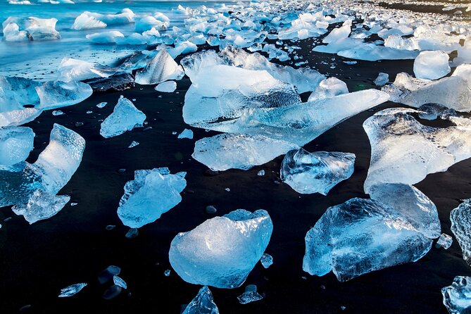 Diamond Beach & Jökulsárlón Floating Glacier Guided Day Tour - Jökulsárlón Glacier Lagoon: the iceberg maze and boat time