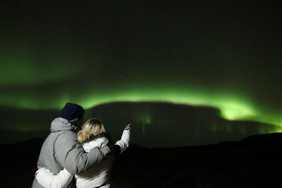 From Reykjavik: Northern Lights Tour with Hot Cocoa & Photos - Aurora Hunting In Motion: Warmth, Dark Skies, and Staying Patient