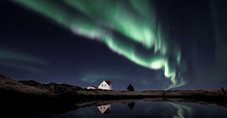 From Reykjavík: Northern Lights Tour with Hot Cocoa & Photos - Pickup from Miðborg and the heated minibus ride (about 90 minutes)