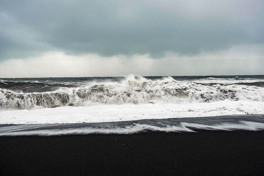 Iceland: Full-Day South Coast, Black Beach & Waterfalls Tour - Reynisfjara black sand beach: basalt columns and the troll-story vibe