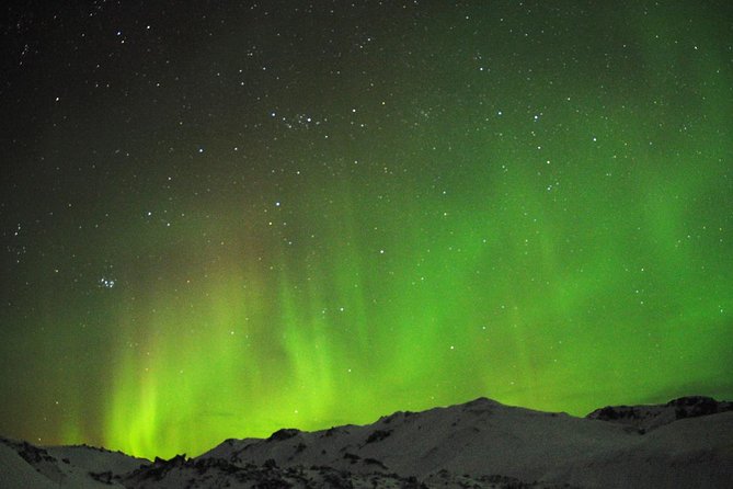 Northern Lights Minibus Tour with Hot Cocoa, Blankets & Photos - Leaving Light Pollution Behind: How the Hunt Gets Better Odds