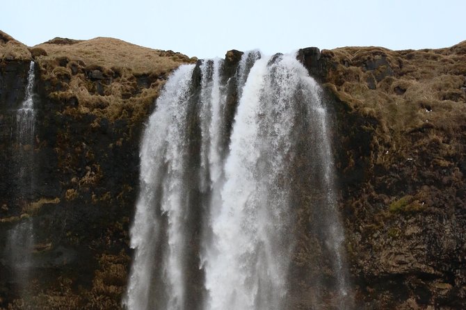 Private South Coast tour in Iceland - Skógafoss: big drop, spray rainbows, and a treasure legend
