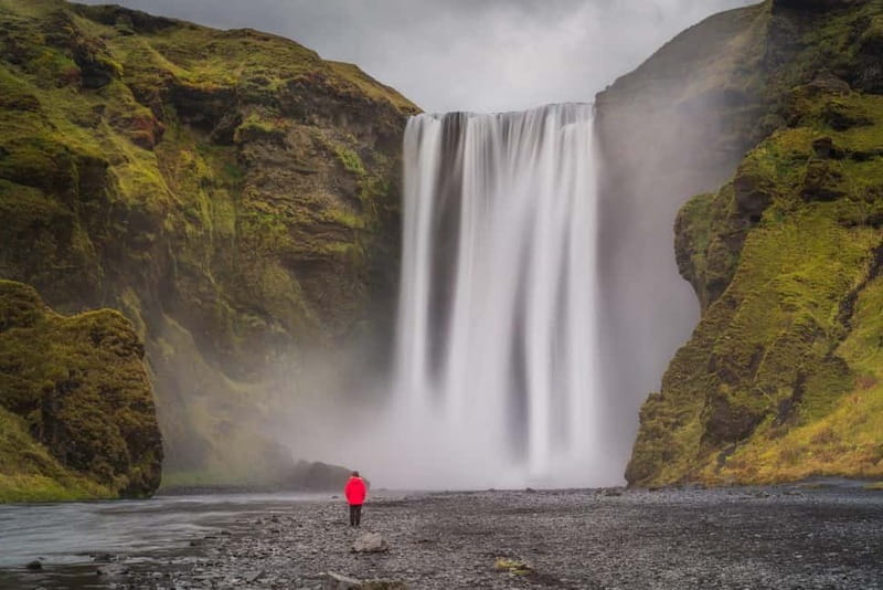 Reykjavík: Epic South Coast Tour - Waterfalls & Black Beach - Skógafoss: 60 meters of waterfall theatre and the story behind it