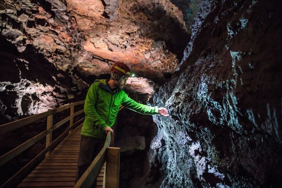 Reykjavik: Lava Cave, Hot Springs, Horses & Waterfalls Tour - Entering Viðgelmir Lava Cave: cold colors and careful footing