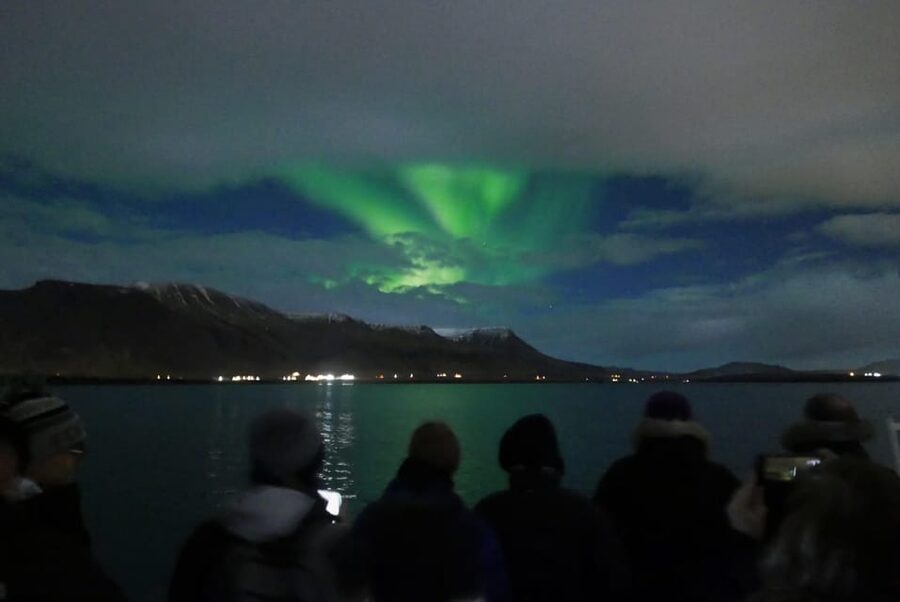Reykjavik: Northern Lights Guided Boat Tour with Photos - Onboard Comfort on Rósin or Andrea: Overalls, Café Stops, and Wi‑Fi