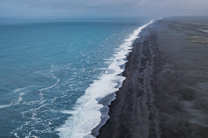 South Coast and Glacier Walk Full day Private Tour From Reykjavík - Skógafoss Waterfall Stop: The 60-Meter Hit of Power